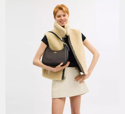 Coach Teri Hobo Bag In Signature Canvas hover