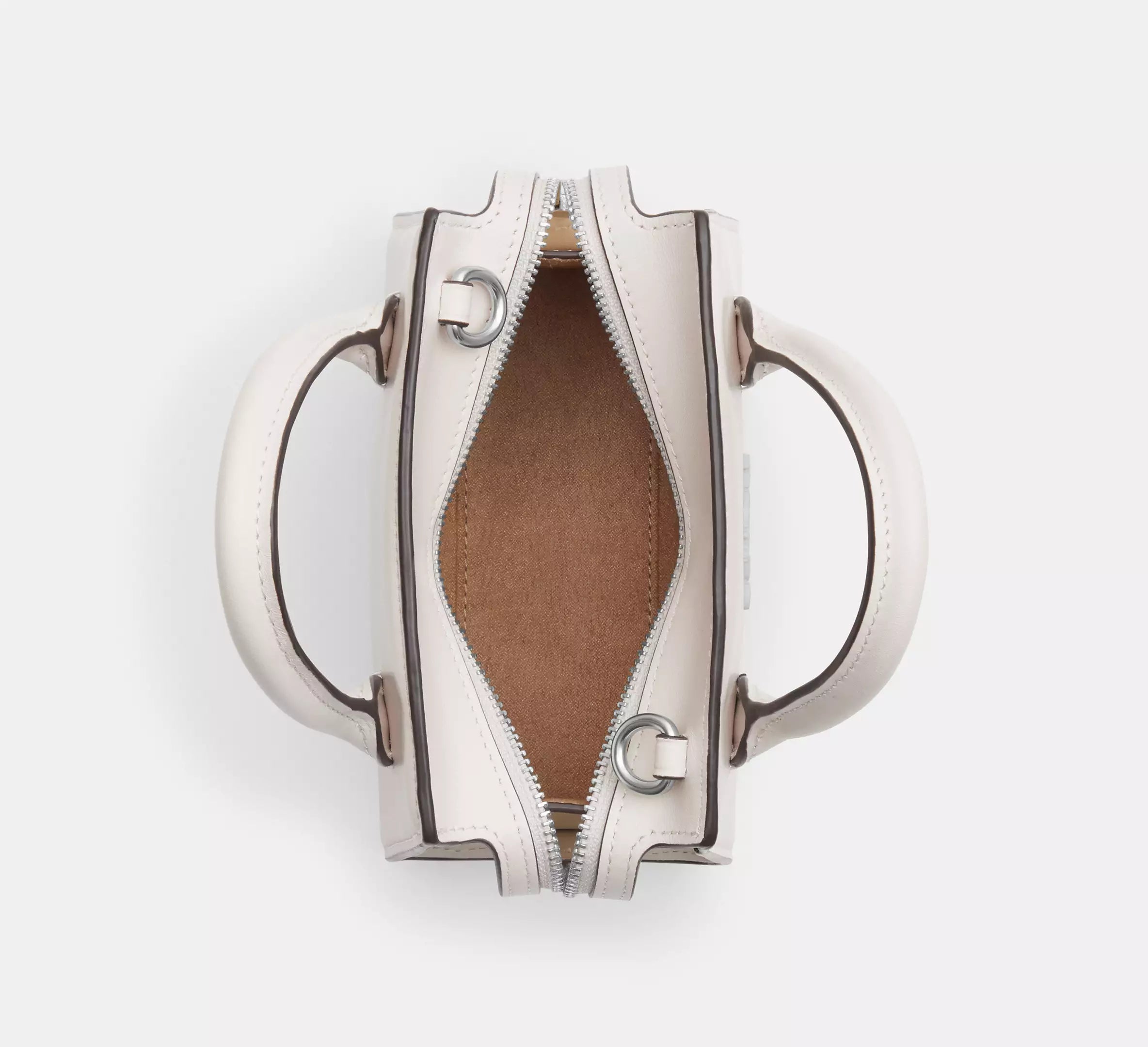 Interior view of white Coach Andrea Carryall Bag with spacious compartments
