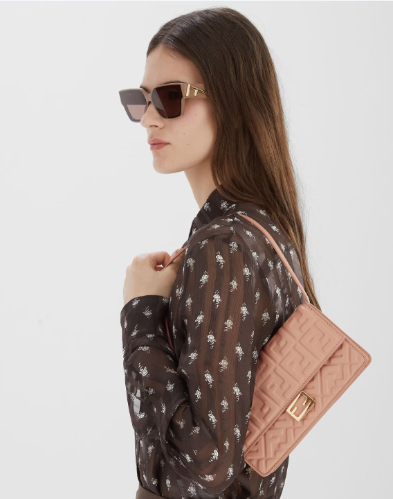 Front view of Fendi Wallet On Chain Baguette in soft pink leather with gold chain and FF logo clasp
