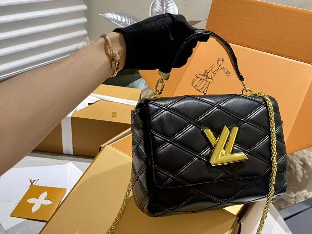 Elegant black LV GO-14 MM handbag with structured shape and chain strap