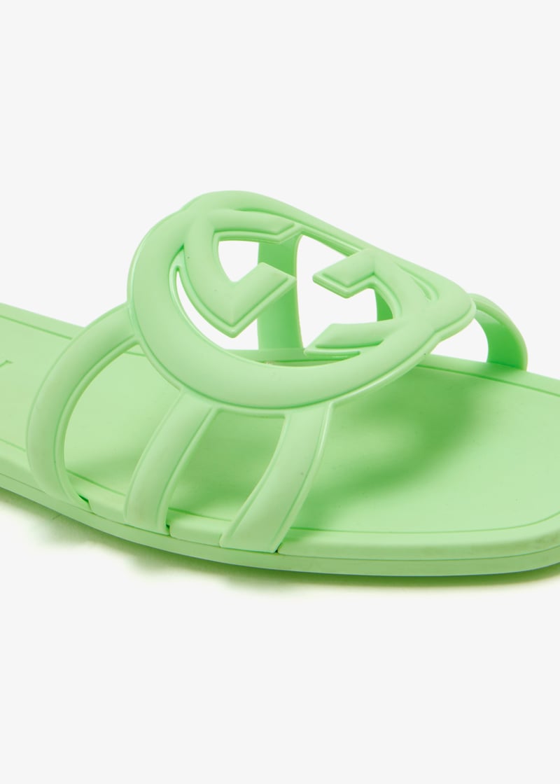 Side angle of green Gucci Mystic logo slides – premium rubber sandals for women with designer branding.