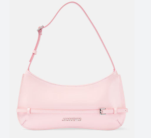 Jacquemus The Kiss bag styled as a crossbody – versatile women’s designer bag with sculptural charm and comfort.