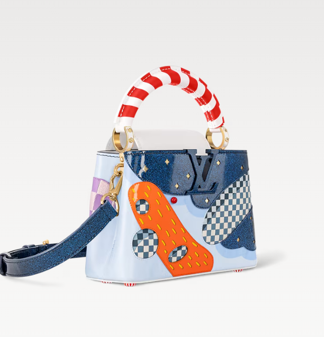 Side profile of Louis Vuitton Capucines – premium leather handbag with gold hardware and refined craftsmanship.