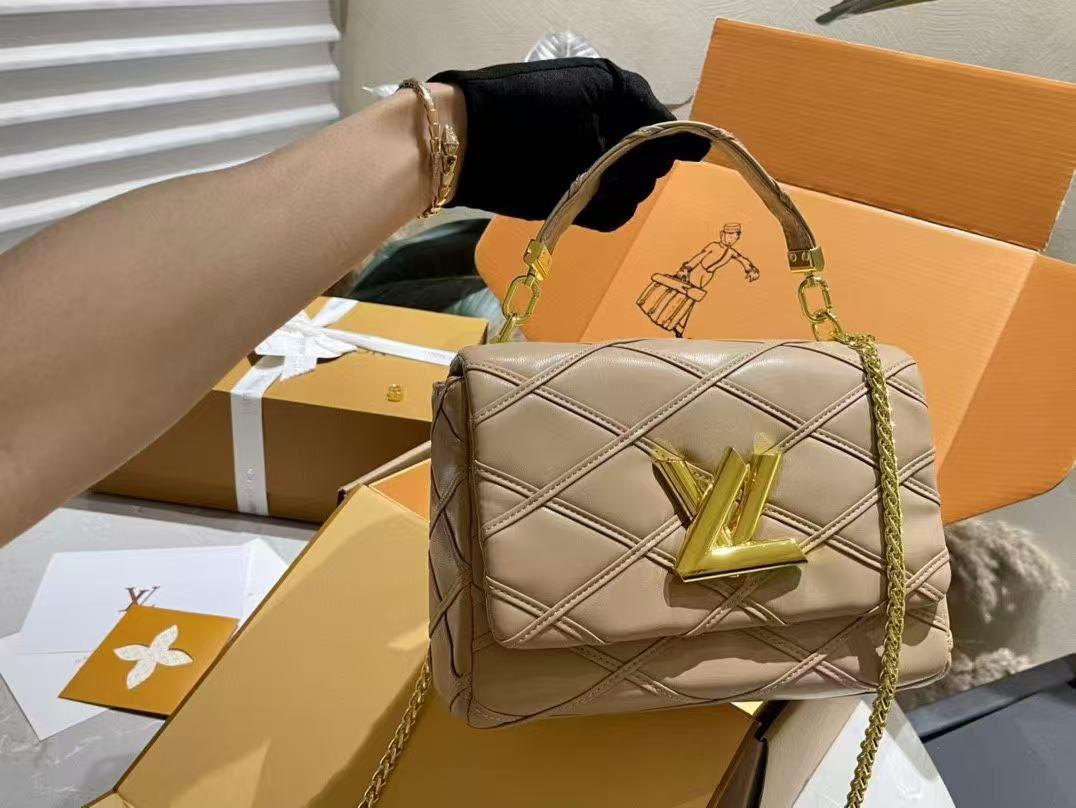 Beige Louis Vuitton GO-14 MM purse in soft leather with classic gold detailing