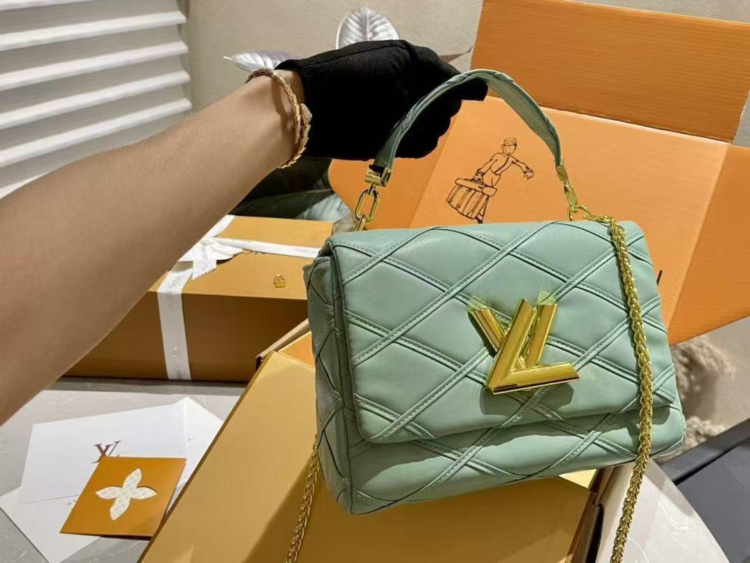 Green Louis Vuitton GO-14 MM handbag featuring signature puffy quilting and top handle