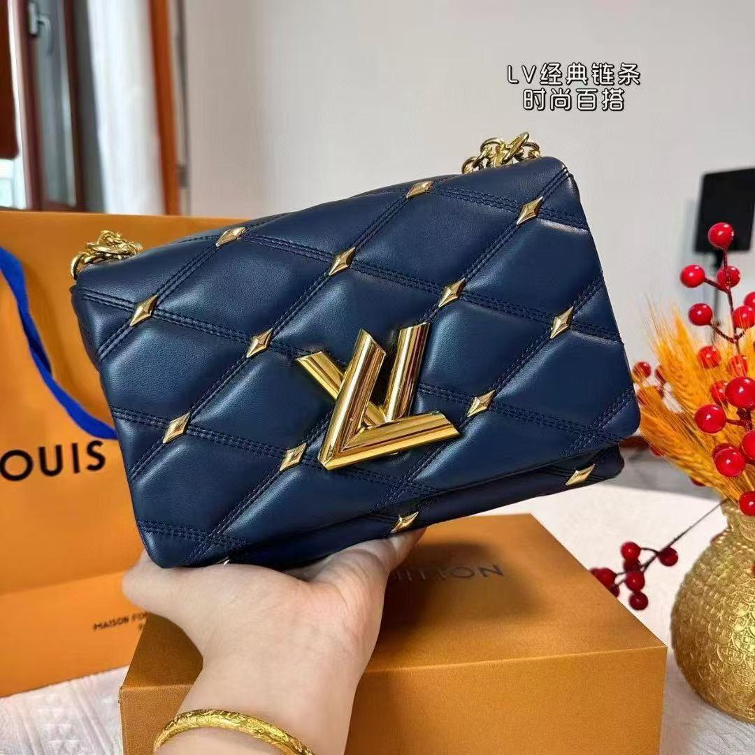 Navy blue LV GO-14 MM handbag featuring top handle and signature puffy quilting