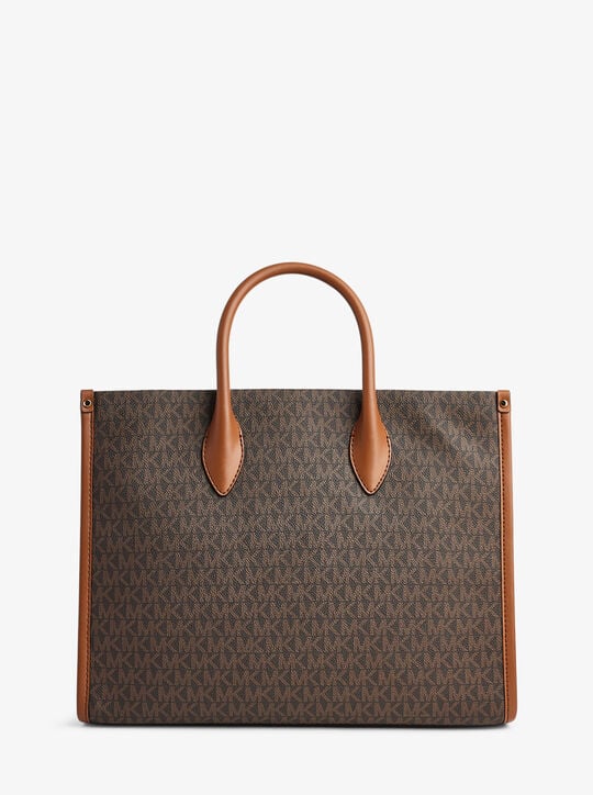 Top handle view of Michael Kors Mirella tote with gold-tone hardware