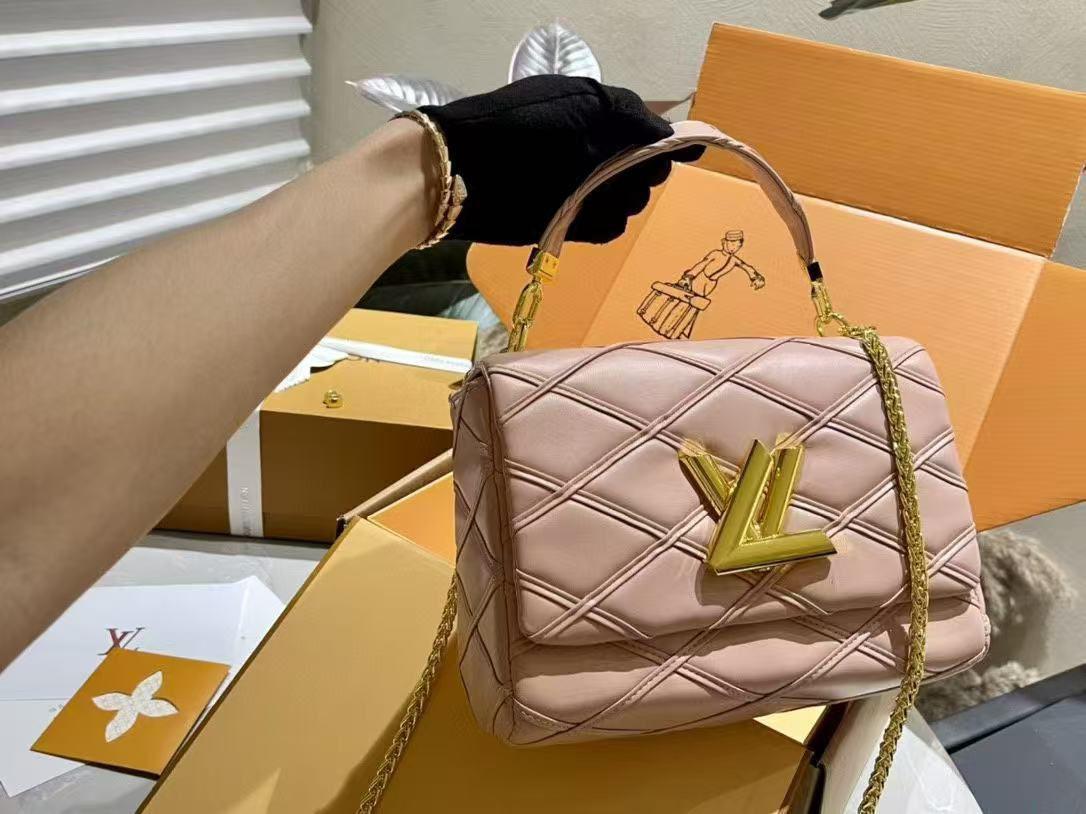 Chic pink GO-14 MM handbag by Louis Vuitton with monogram accent and luxurious finish