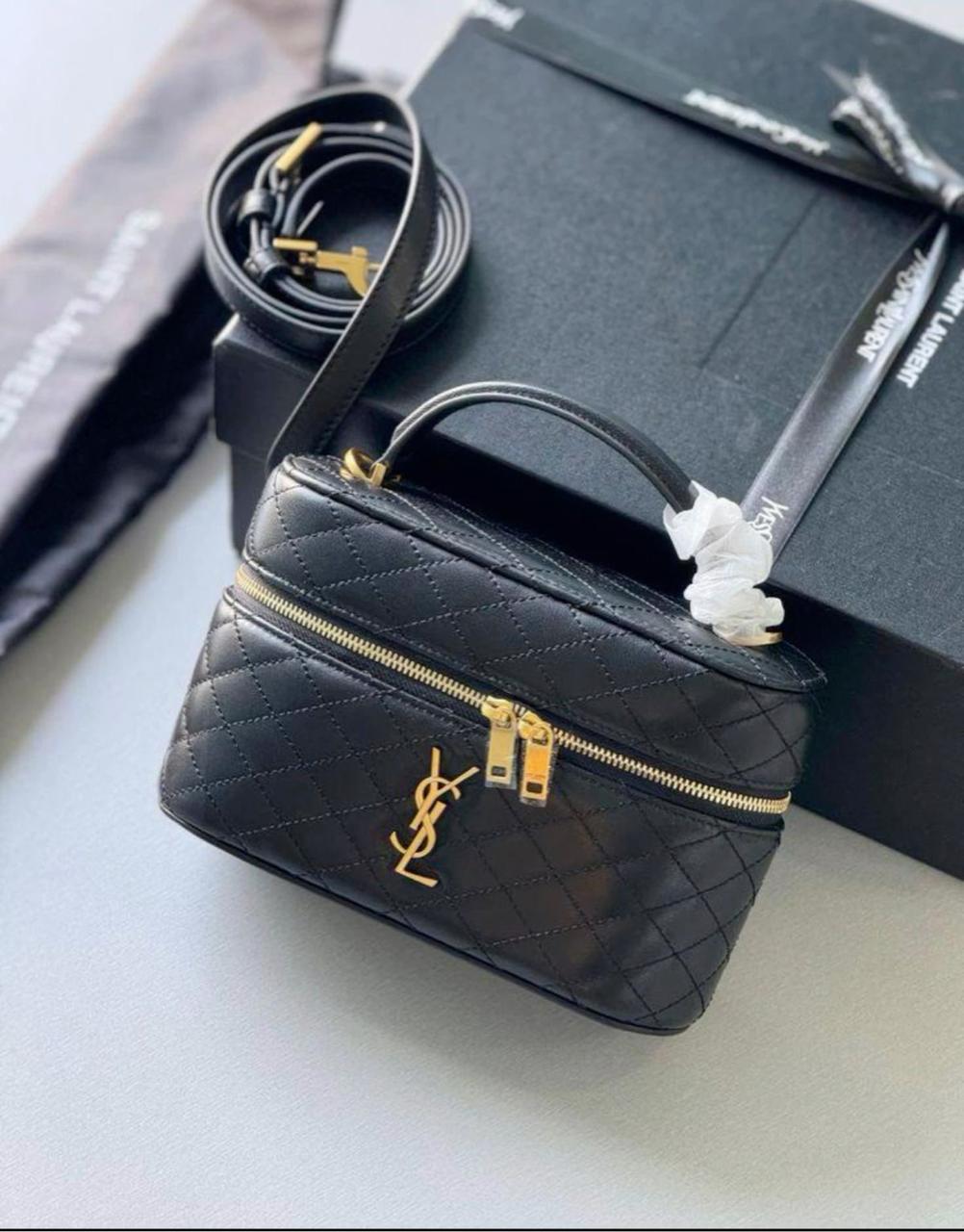Close-up of Saint Laurent GABY vanity bag logo and lambskin leather – premium craftsmanship and elegant branding on women’s handbag.