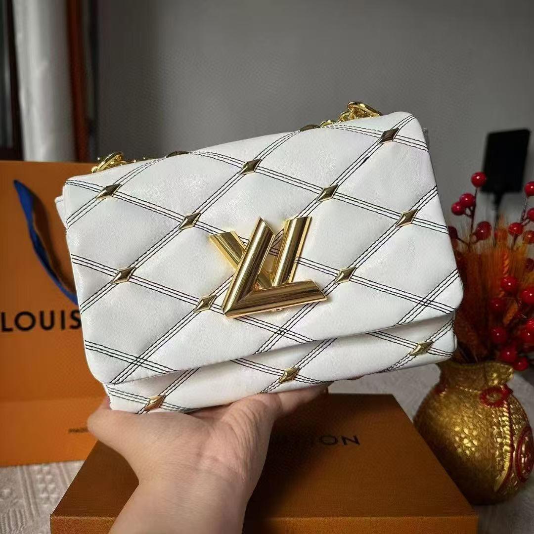 White Louis Vuitton GO-14 MM handbag with elegant chain strap and sleek design