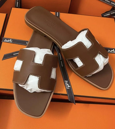 HERMÈS Brown Gold Calfskin Oran Sandals