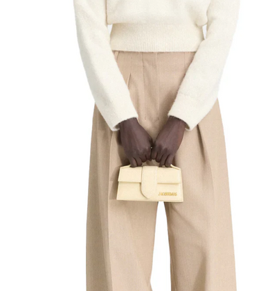 The Bambino Small handbag with adjustable crossbody strap. hover