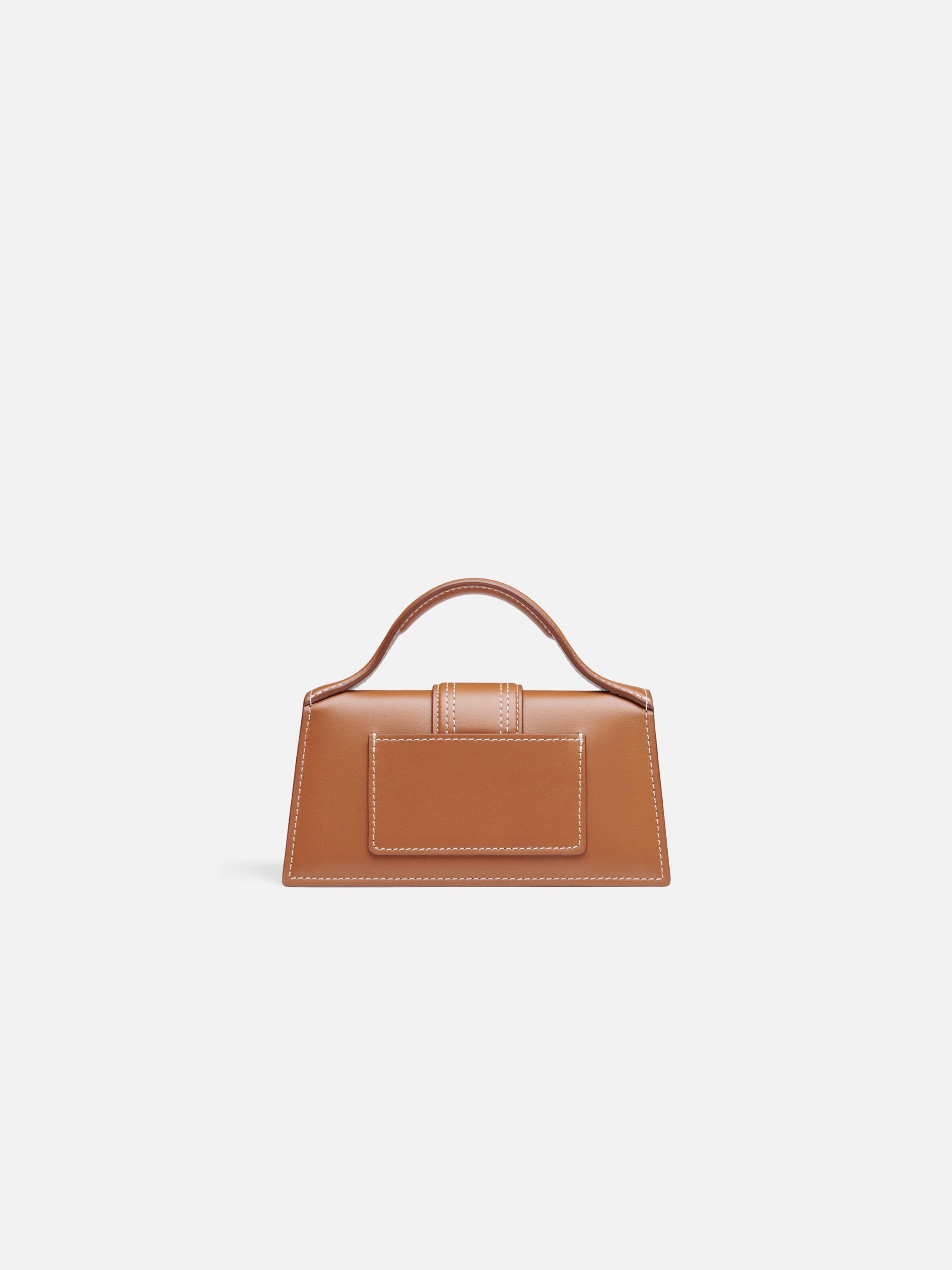 The Bambino Small handbag with adjustable crossbody strap.