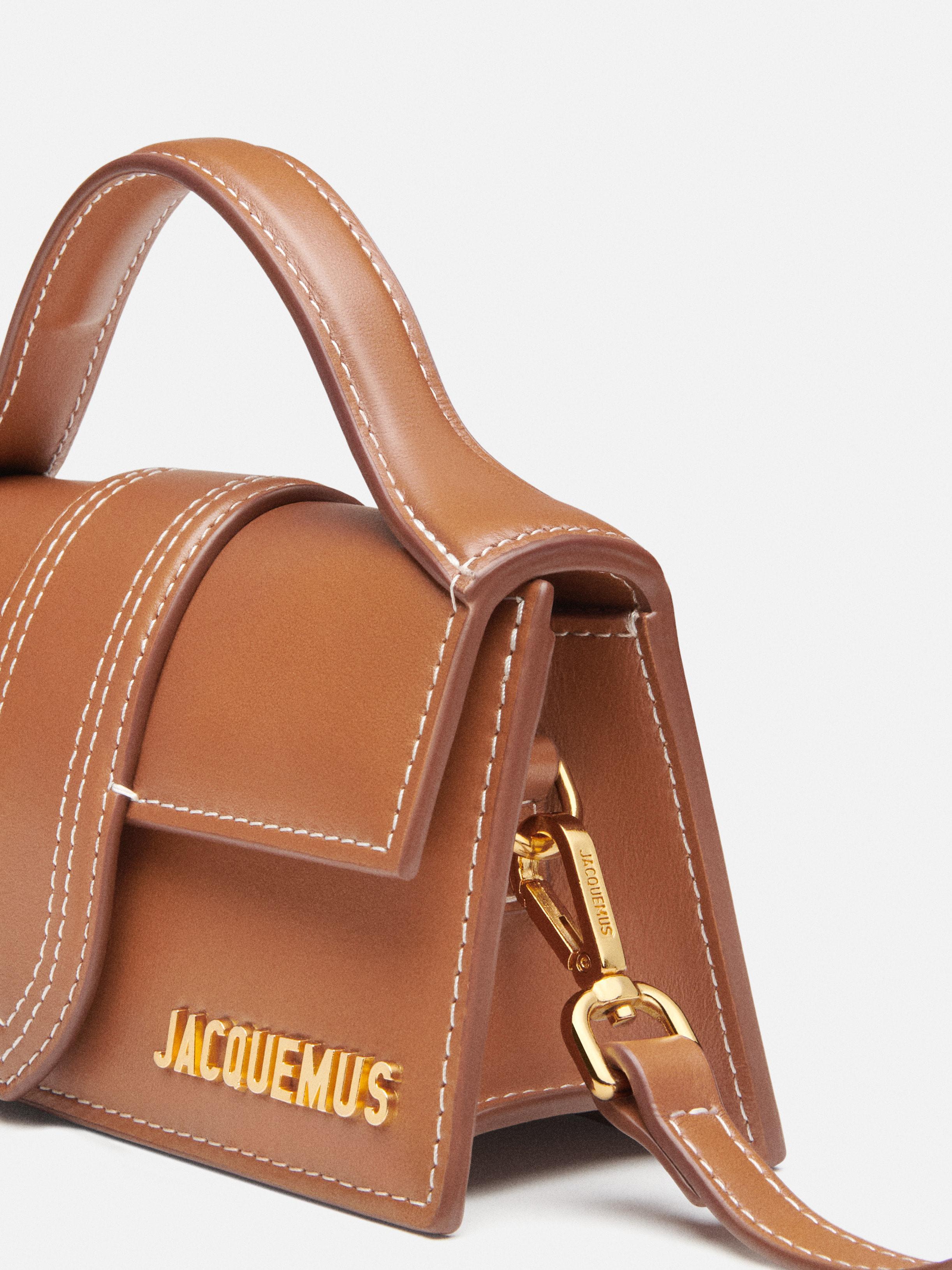 The Bambino Small handbag with adjustable crossbody strap.
