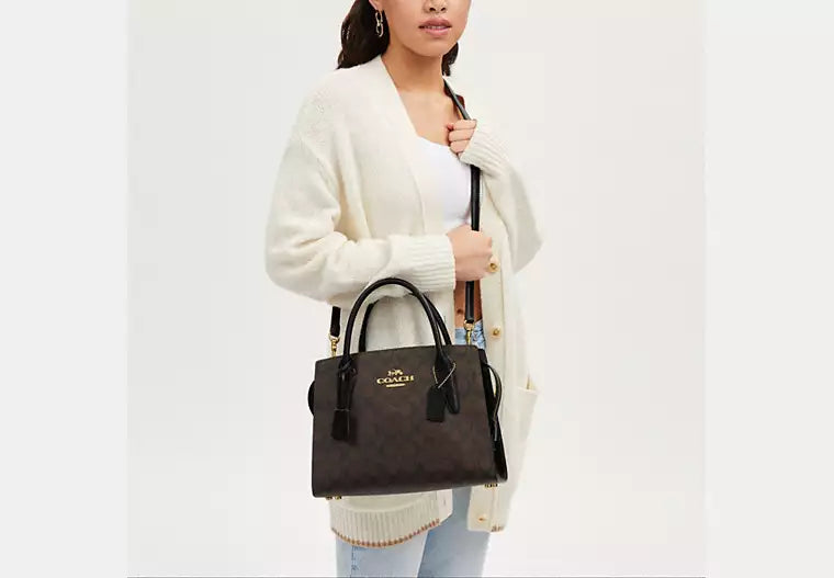 Front view of Coach Andrea Carryall in signature canvas with logo detail