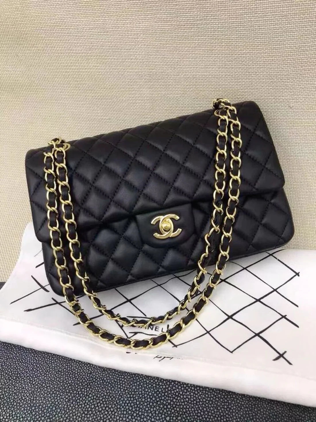 CHANEL Classic Double Flap Bag in black quilted leather, known for its elegance and iconic design for women.