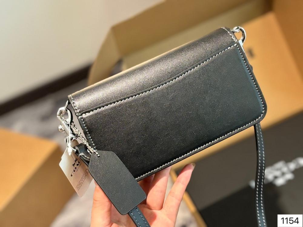 Front view of Coach Tony Mini Crossbody Leather Bag in black with gold-tone hardware