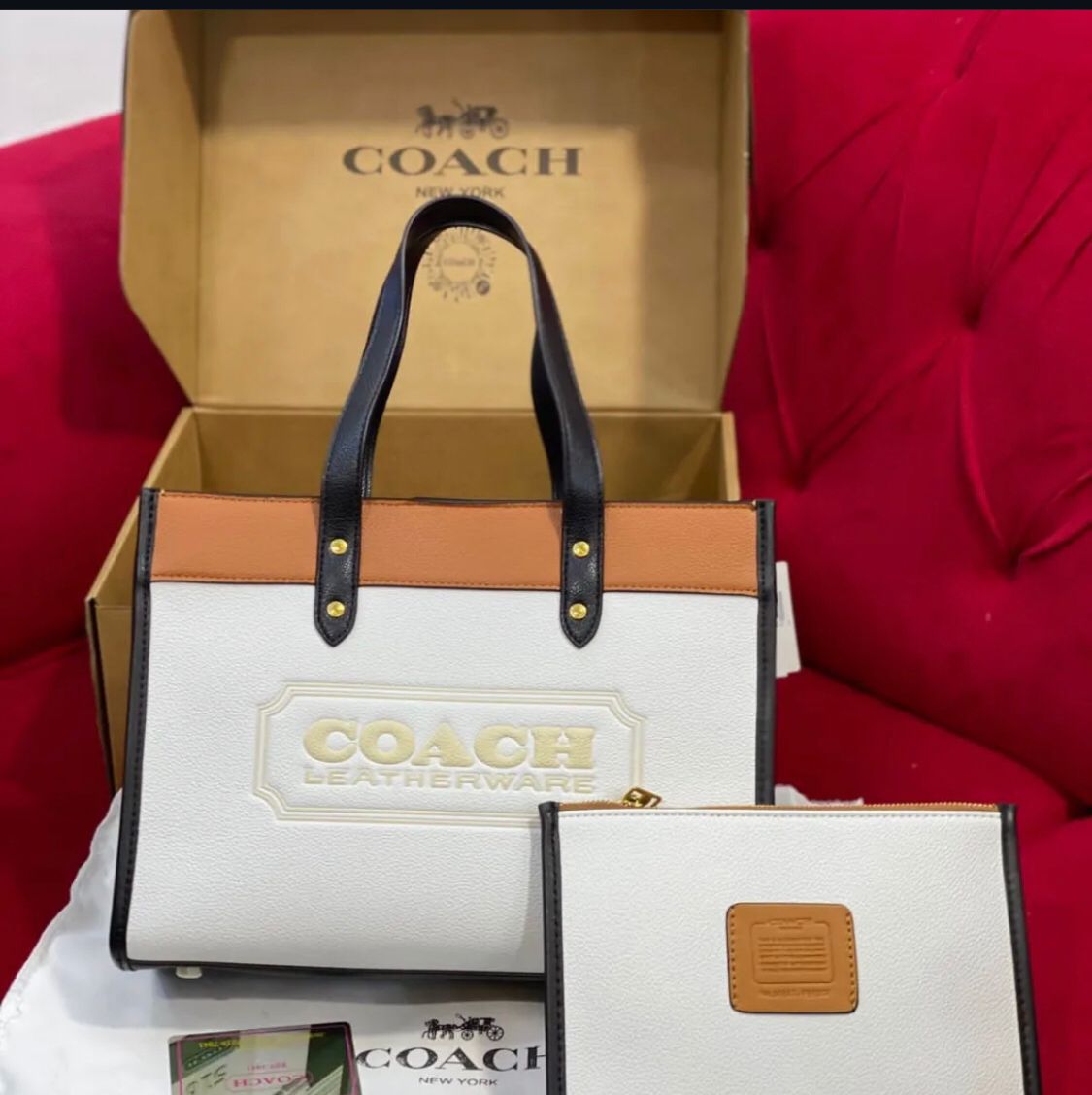 Close-up of the Coach Field Tote 22 in Colorblock, showcasing the Coach badge and premium leather finish.