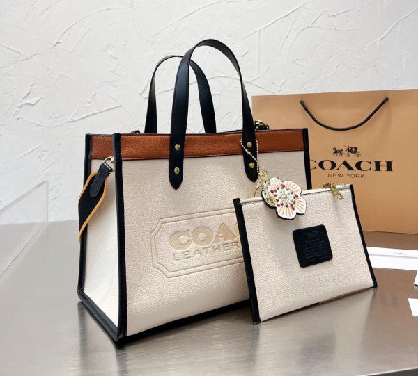 Coach Field Tote 22 in Colorblock with leather finish, a perfect combination of style and functionality.