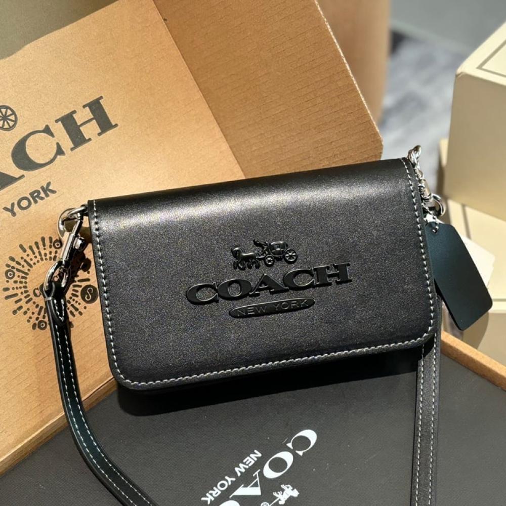 Front view of Coach Tony Mini Crossbody Leather Bag in black with gold-tone hardware