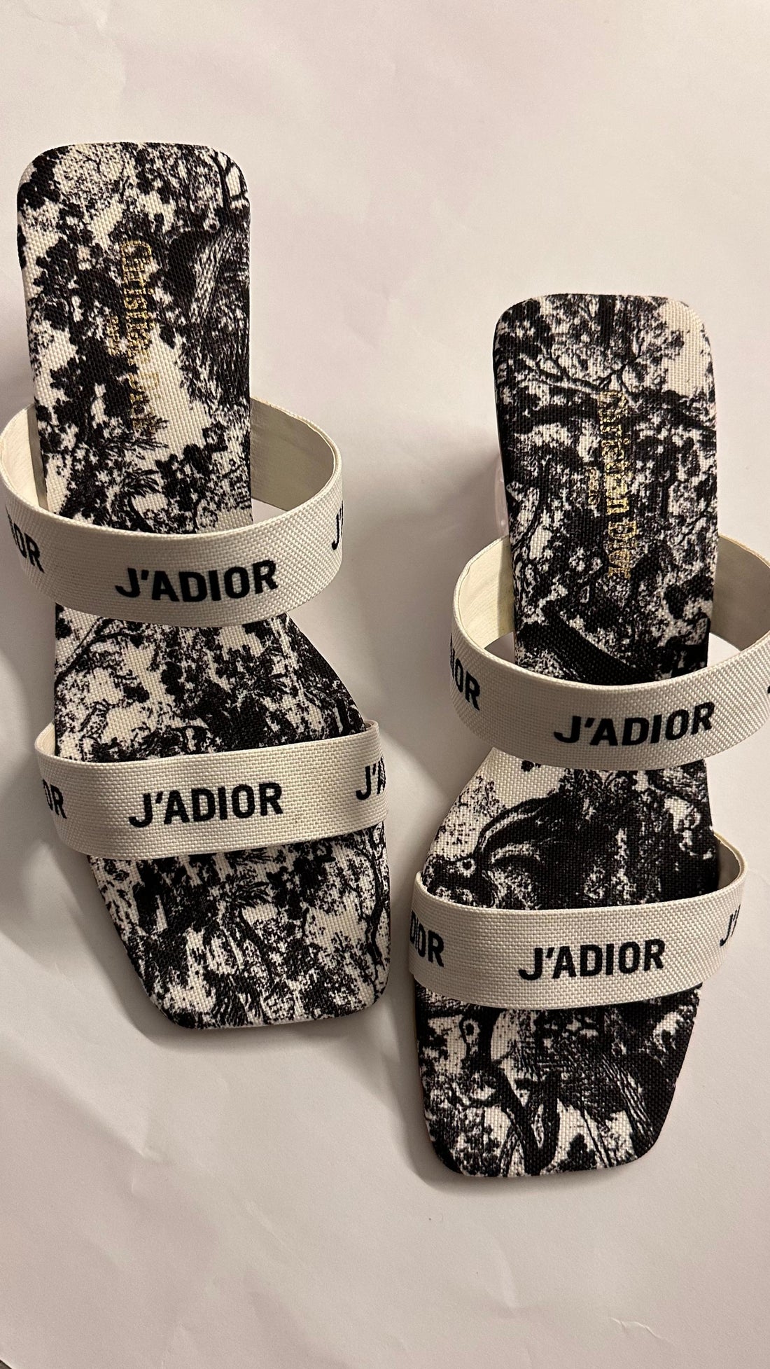 Front view of Dior J’ADIOR Monochrome Mules – elegant pointed-toe designer mules with iconic embroidered ribbon detail.