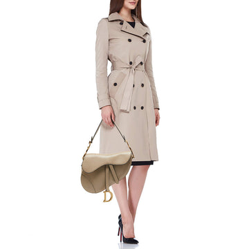 Front view of Dior Saddle Bag with strap – iconic women’s designer handbag with signature curved silhouette and classic elegance.