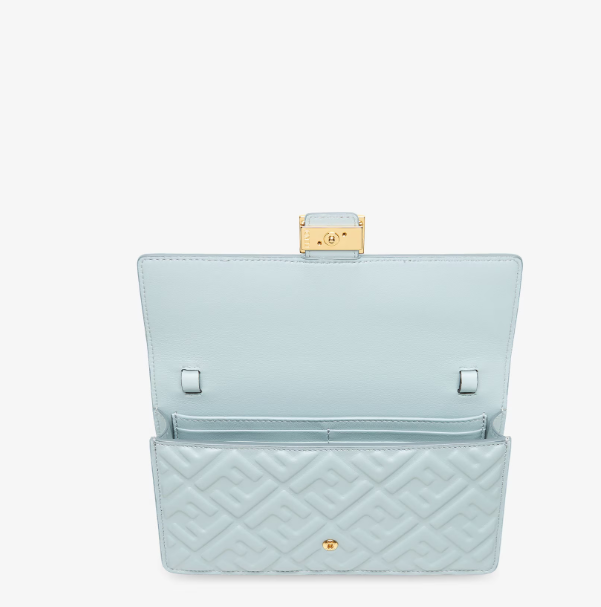 Close-up of Fendi Baguette Wallet showing iconic FF logo hardware and smooth leather finish