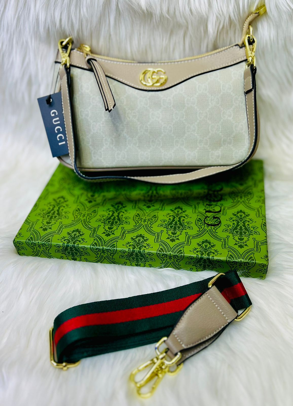 Interior of the Gucci Luxe Stylish Handbag in beige, pink, and brown, featuring multiple pockets and luxurious lining.