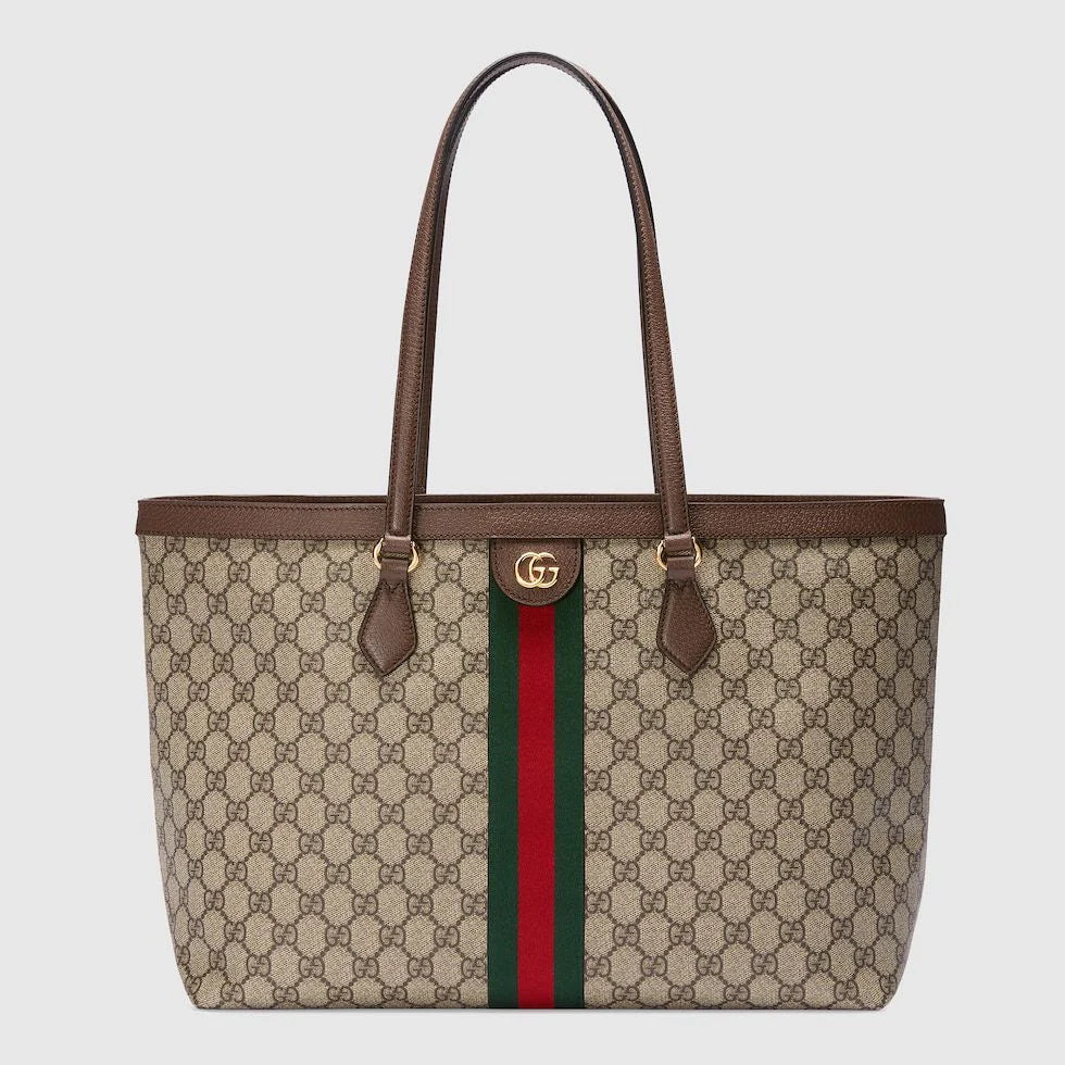 Close-up of GUCCI leather tote bag, highlighting the signature GG pattern and luxurious craftsmanship.