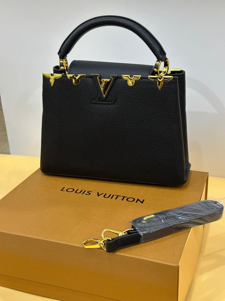 Interior view of Louis Vuitton bag – spacious compartment with fine leather lining and functional pockets.