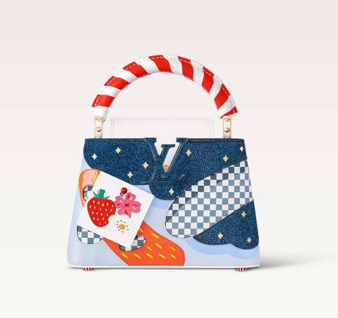 Front view of Louis Vuitton Capucines bag – elegant designer handbag with structured silhouette and signature LV monogram clasp.