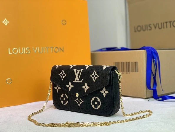 Interior of black Louis Vuitton Félicie Pochette – includes removable zip pouch and cardholder for organized storage.