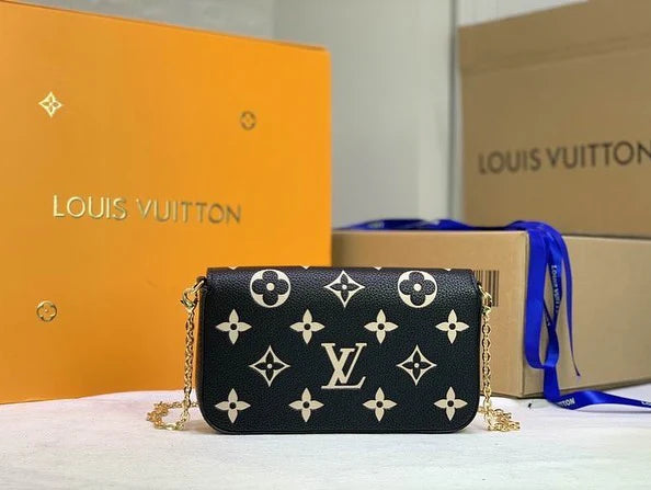 Front view of Louis Vuitton Félicie Pochette in black – elegant monogram-embossed clutch bag with envelope flap and sleek silhouette.