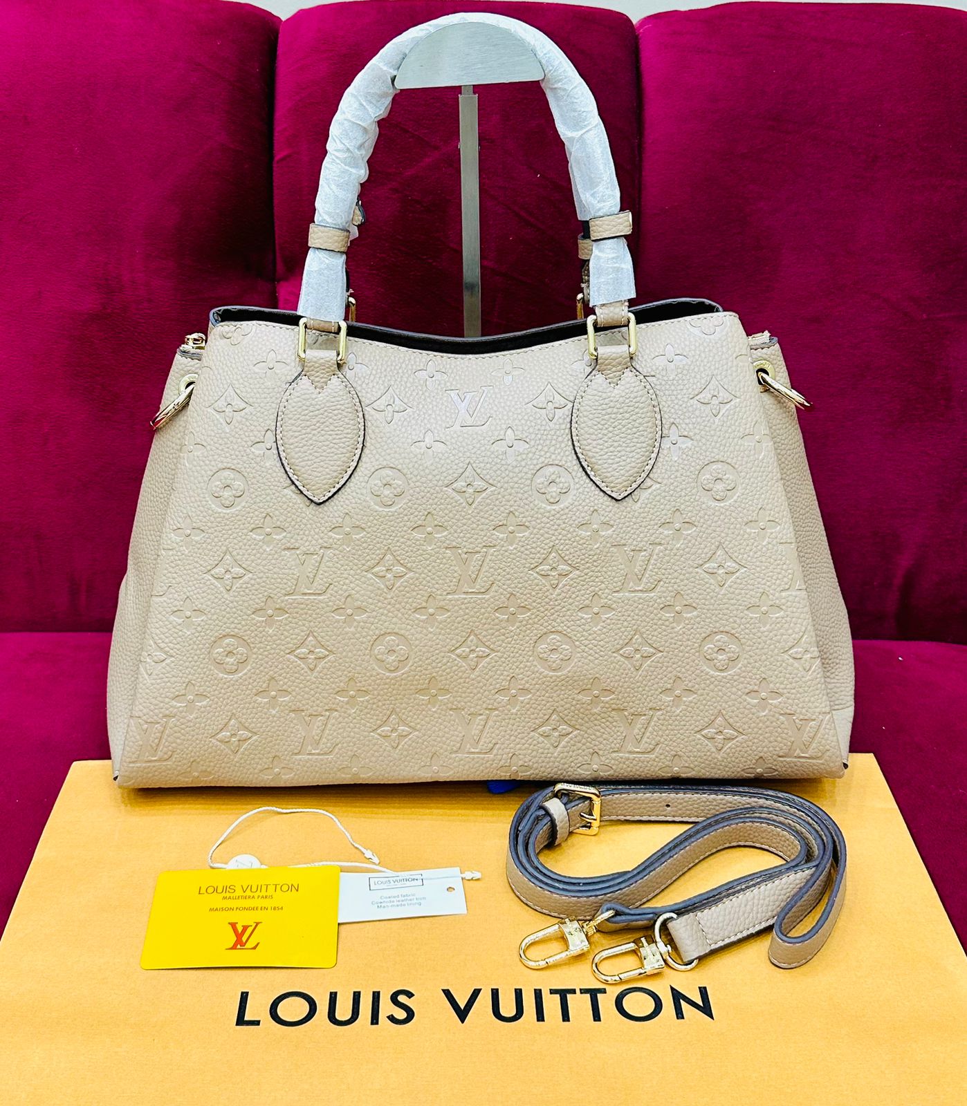 Elegant beige LV Vendôme MM top handle bag with timeless design and luxury appeal
