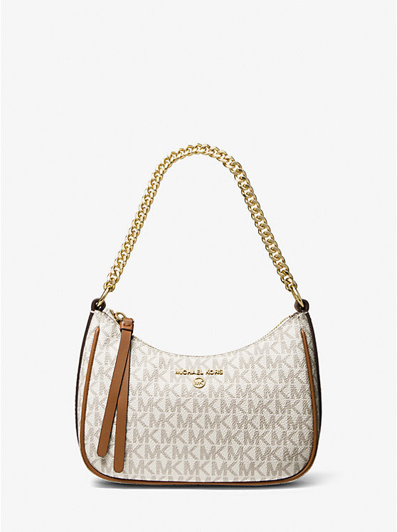 Model carrying Michael Kors Jet Set Charm Small Logo Pochette – chic crossbody or shoulder bag for casual and stylish outfits.