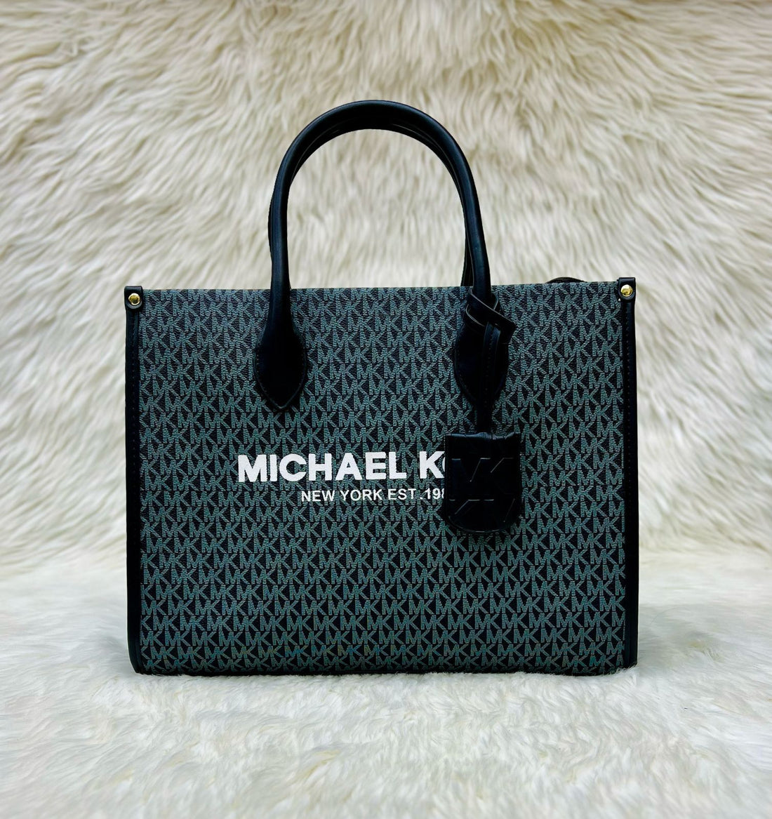 Collection of Michael Kors tote bags featuring signature designs and logo prints