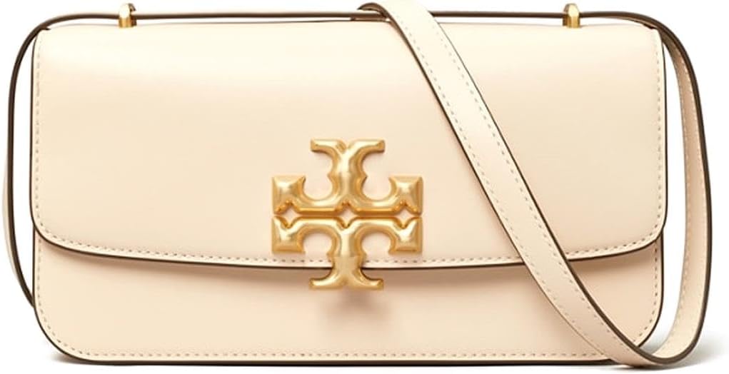 Close-up of Tory Burch Britten logo and adjustable strap – premium detailing on a luxury women's shoulder bag.