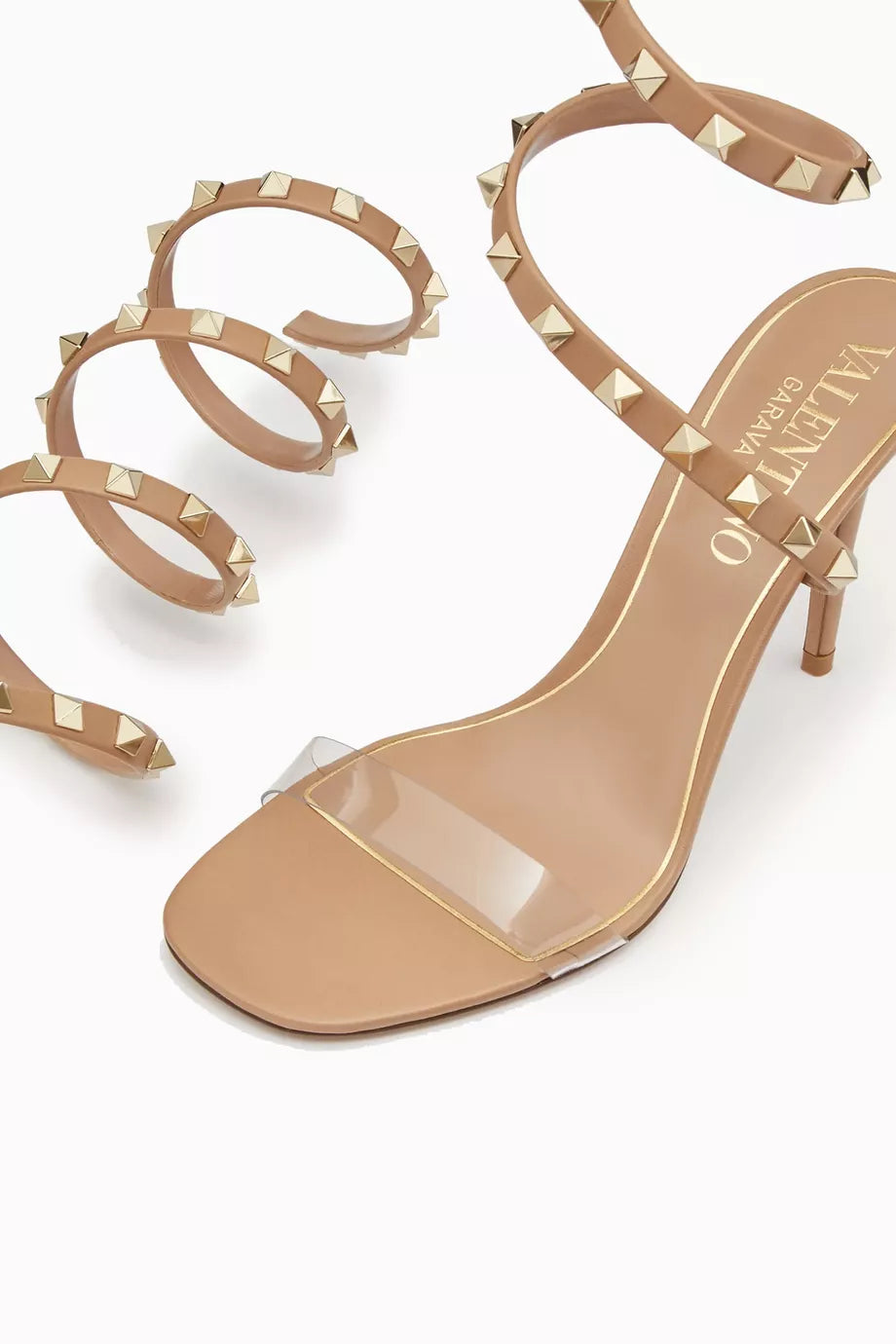 Front view of Valentino Rockstud lace-up heels – elegant women’s sandals with iconic studded straps and pointed toe.