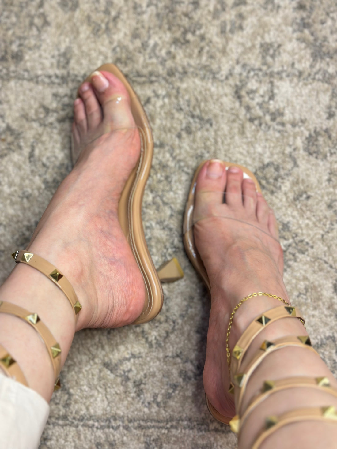 Front view of Valentino Rockstud lace-up heels – elegant women’s sandals with iconic studded straps and pointed toe.