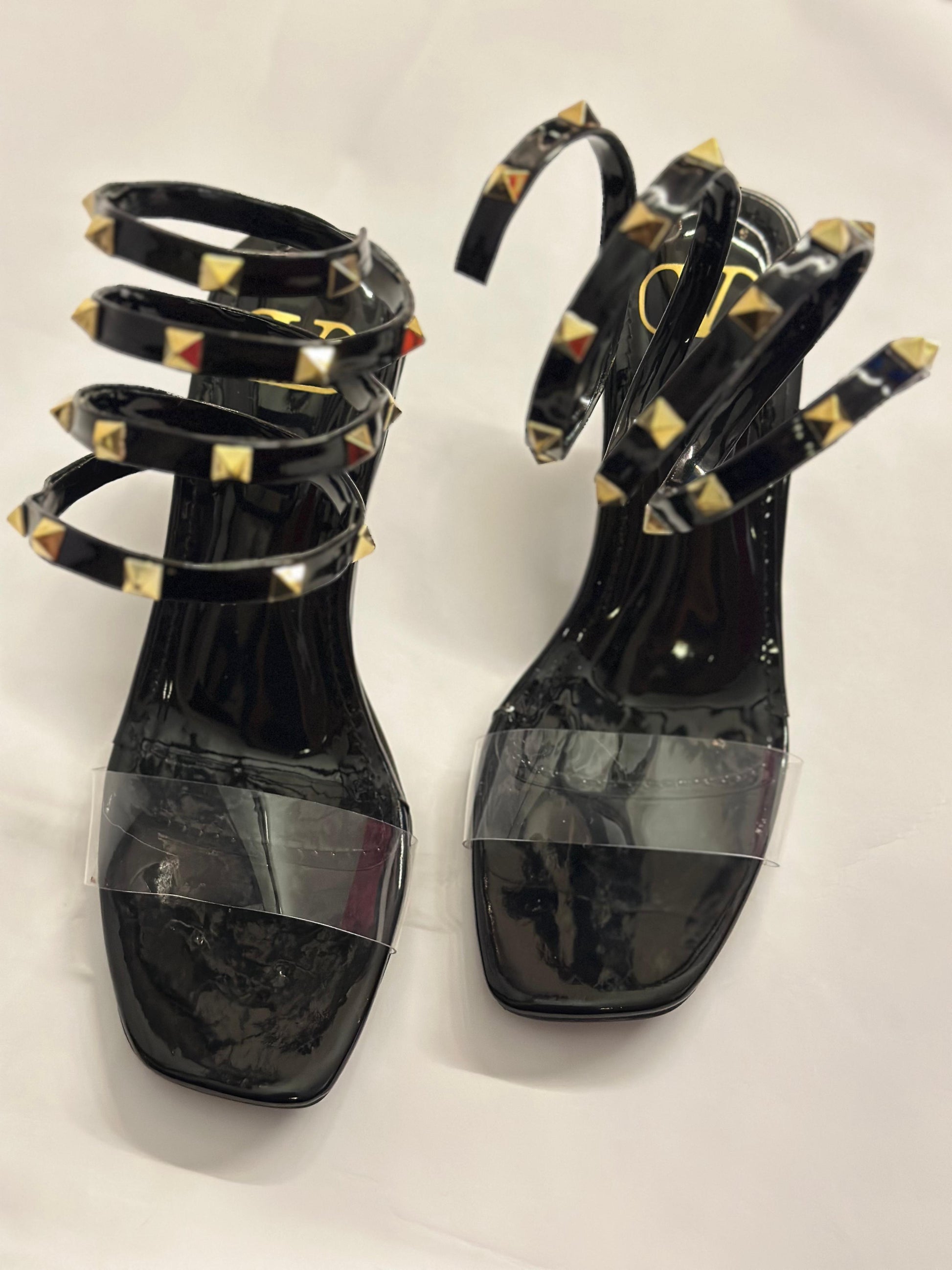 Bottom sole view of Valentino Rockstud sandals – luxury craftsmanship and durable heel construction for women’s wear.