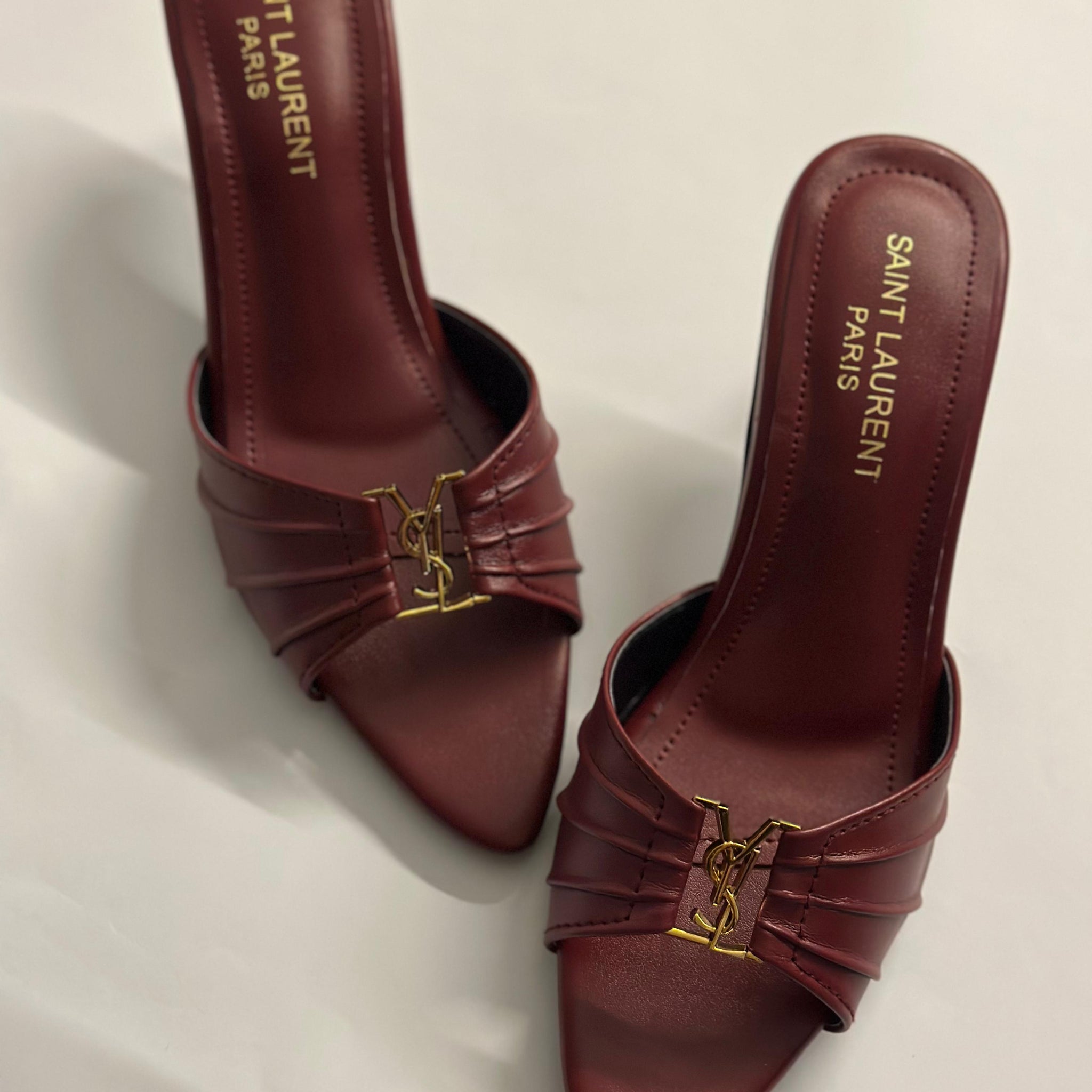 Front view of YSL Garnet Charm Pointed Heels – elegant pointed-toe designer heels in deep garnet red with sleek leather finish.