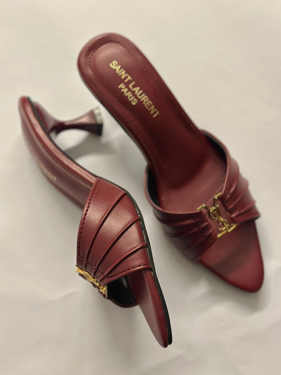 Front view of YSL Garnet Charm Pointed Heels – elegant pointed-toe designer heels in deep garnet red with sleek leather finish.