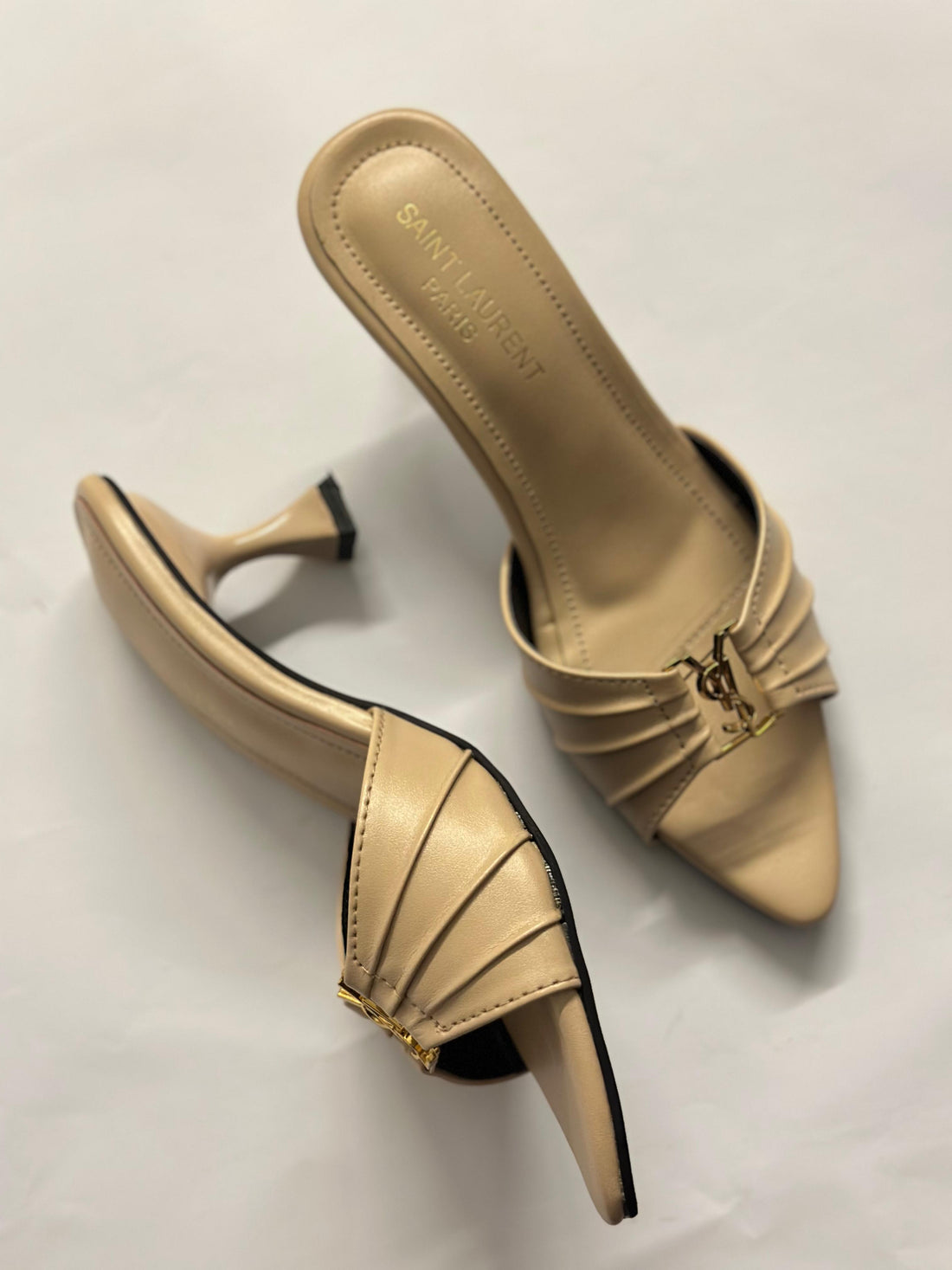 Front view of YSL Luxe Nude Slide Heels – elegant nude-toned designer heels for women with minimalist front strap design.