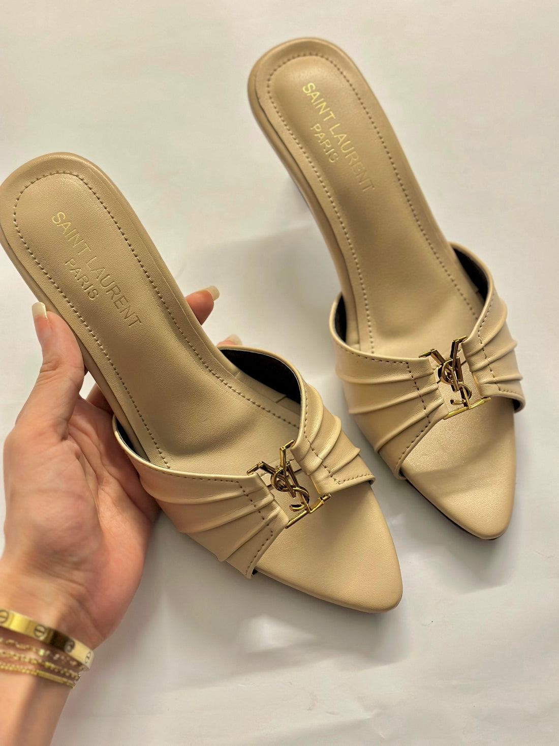 Front view of YSL Luxe Nude Slide Heels – elegant nude-toned designer heels for women with minimalist front strap design.